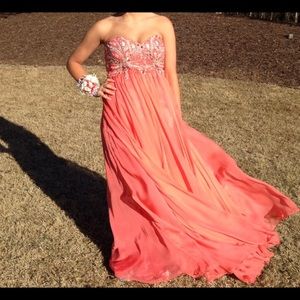 Coral strapless gown.